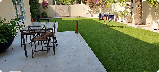 Backyard garden with black gravel border